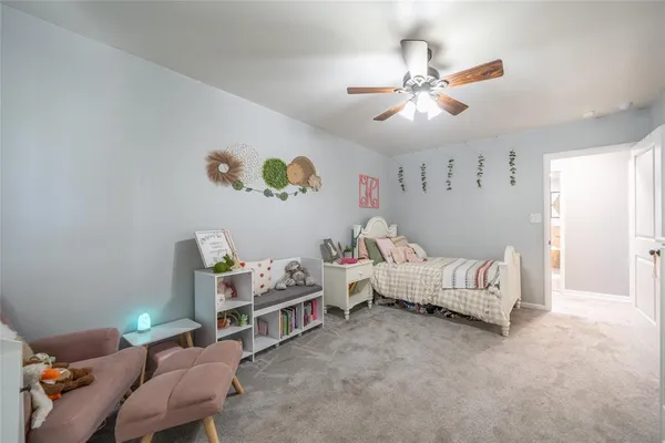 a bedroom with furniture and a window