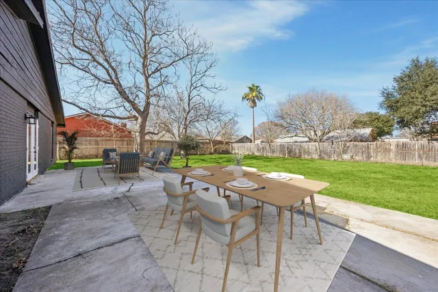 a view of yard with seating area and green space