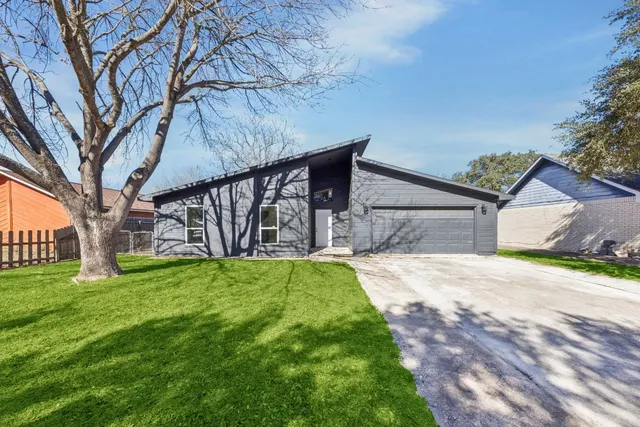 a house with yard in front of it