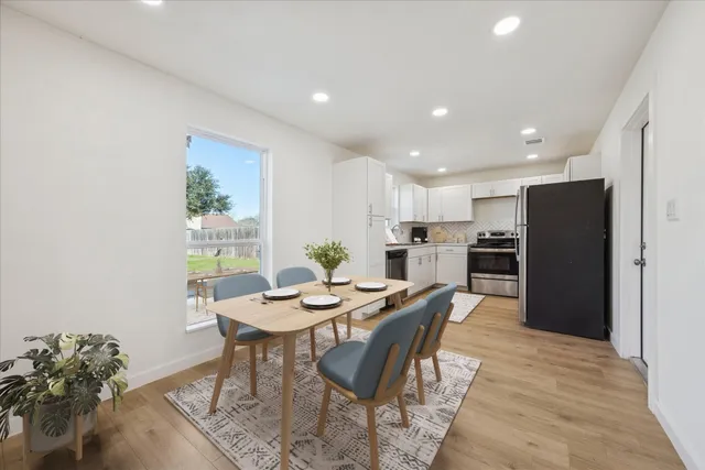 a view of a dining room with furniture