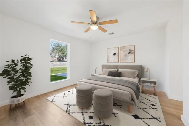 a bedroom with a bed and a window