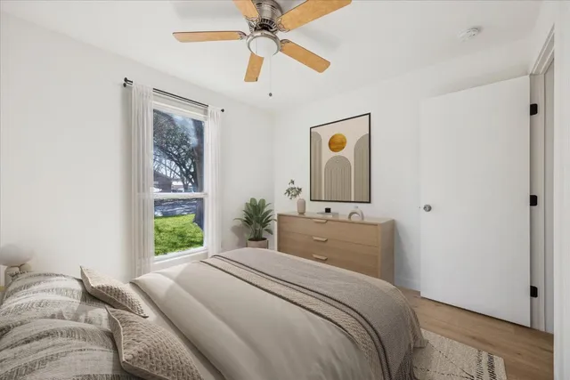 a bedroom with a bed and a window