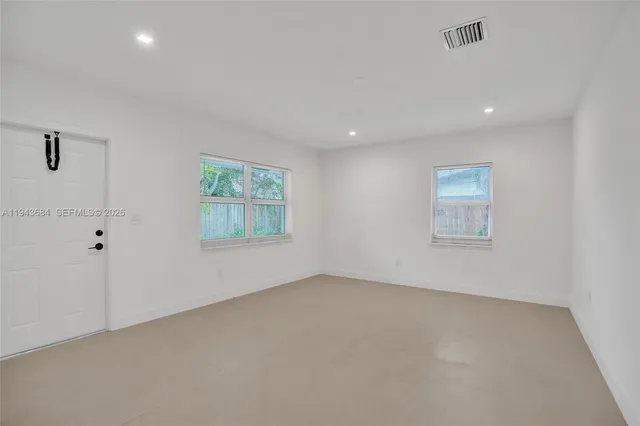 an empty room with windows