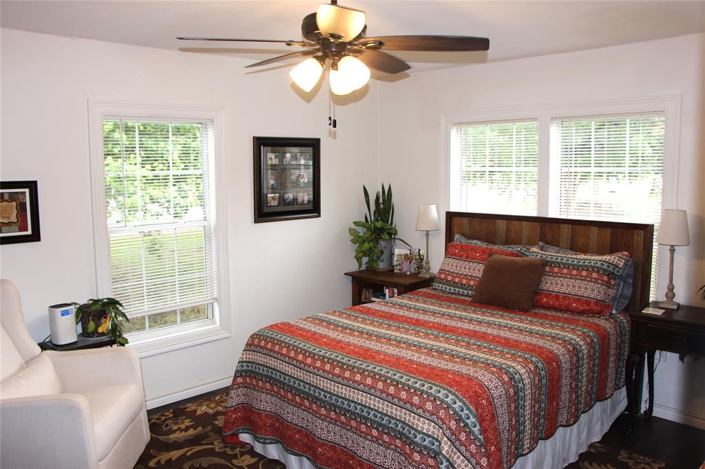800 Griffin Road Albany, TX 76430 - Photo 6 of 15 a bedroom with a bed and a window
