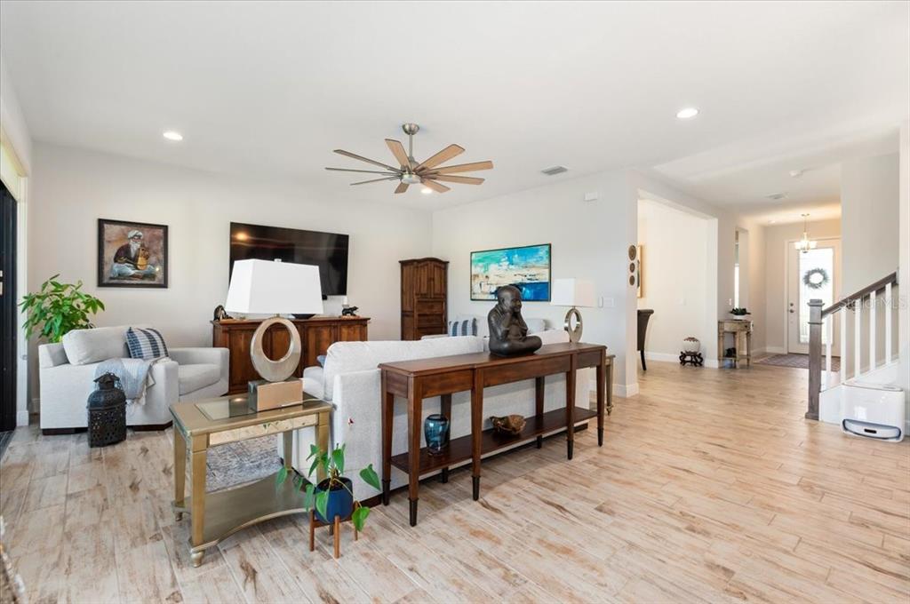 7440 Rhubarb Drive Parrish, FL 34219 - Photo 11 of 59 a living room with furniture and a wooden floor