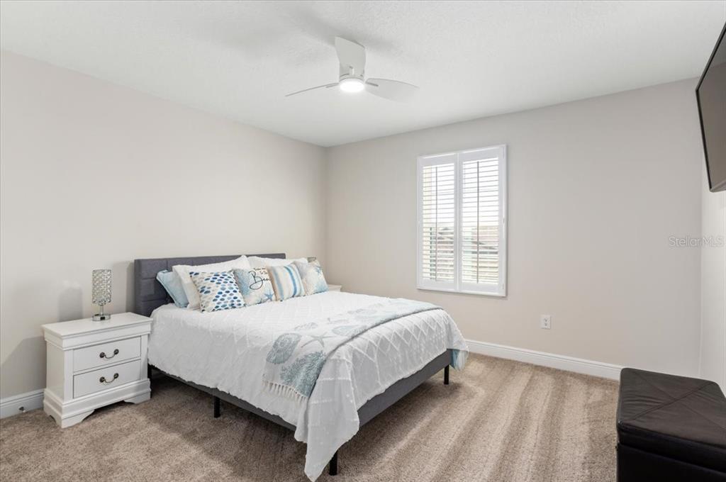 7440 Rhubarb Drive Parrish, FL 34219 - Photo 26 of 59 a bedroom with a bed and a window