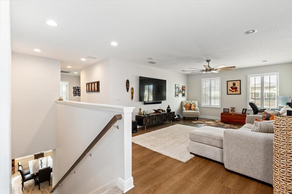 7440 Rhubarb Drive Parrish, FL 34219 - Photo 27 of 59 a living room with furniture and a flat screen tv