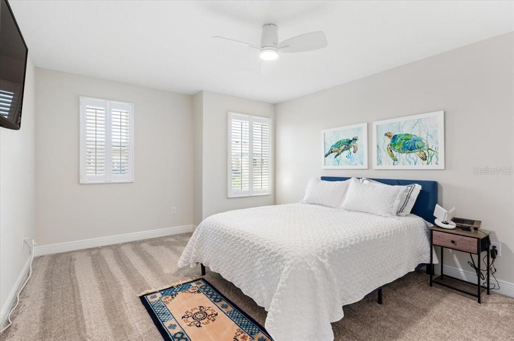 7440 Rhubarb Drive Parrish, FL 34219 - Photo 37 of 59 a bedroom with a bed and a window