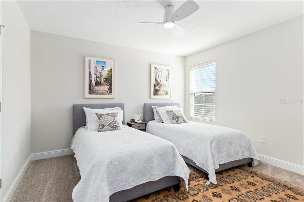 7440 Rhubarb Drive Parrish, FL 34219 - Photo 40 of 59 a bedroom with two beds and a window