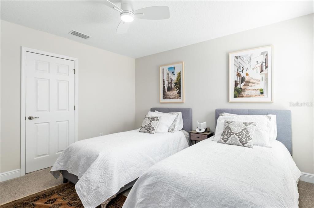 7440 Rhubarb Drive Parrish, FL 34219 - Photo 41 of 59 a bedroom with two beds and painting on the wall