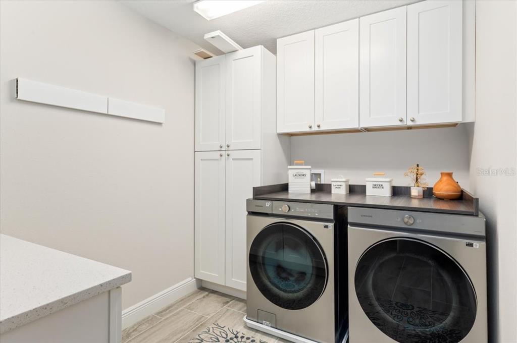 7440 Rhubarb Drive Parrish, FL 34219 - Photo 44 of 59 a utility room with sink dryer and washer