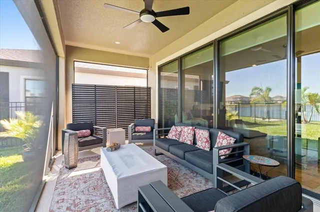 a living room with furniture and a large window