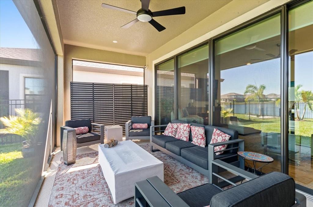 7440 Rhubarb Drive Parrish, FL 34219 - Photo 7 of 59 a living room with furniture and a large window
