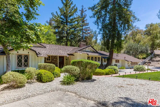 front view of a house with a small yard