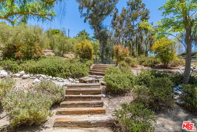 a view of statue in a garden