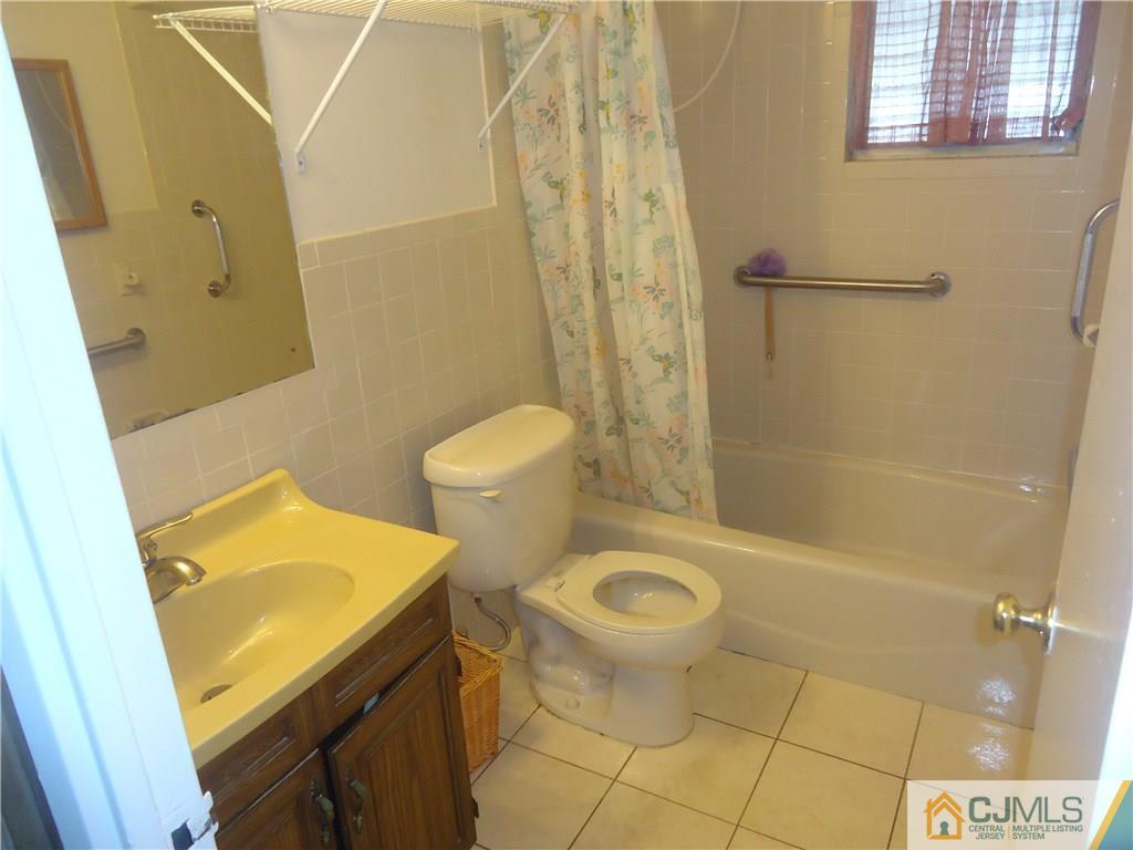 27 Comstock Road Edison, NJ 08817 - Photo 6 of 7 a bathroom with a sink and a shower
