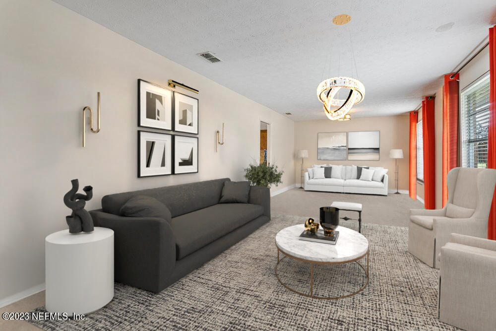 1807 Mill Creek Road Jacksonville, FL 32277 - Photo 5 of 18 a living room with furniture and a large window