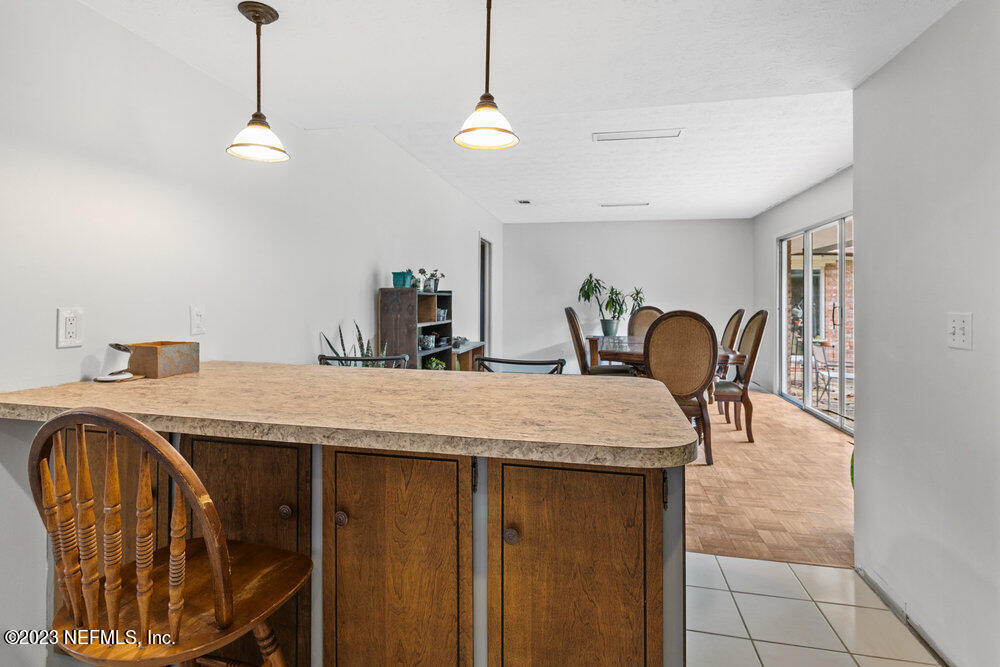 1807 Mill Creek Road Jacksonville, FL 32277 - Photo 7 of 18 a room with a table chairs and entryway