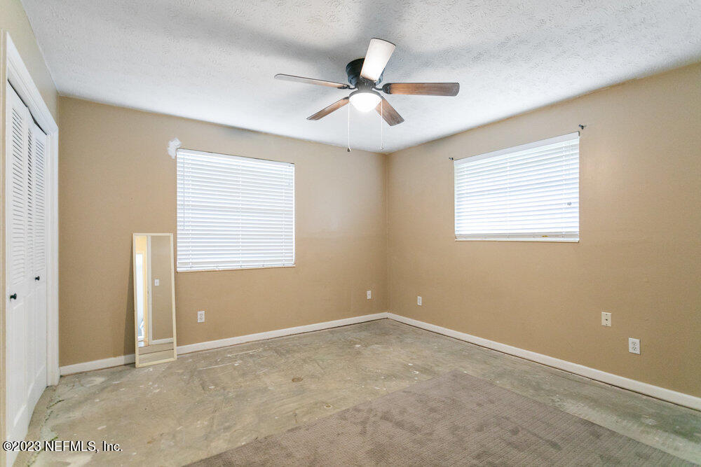 1807 Mill Creek Road Jacksonville, FL 32277 - Photo 10 of 18 a view of an empty room with a window
