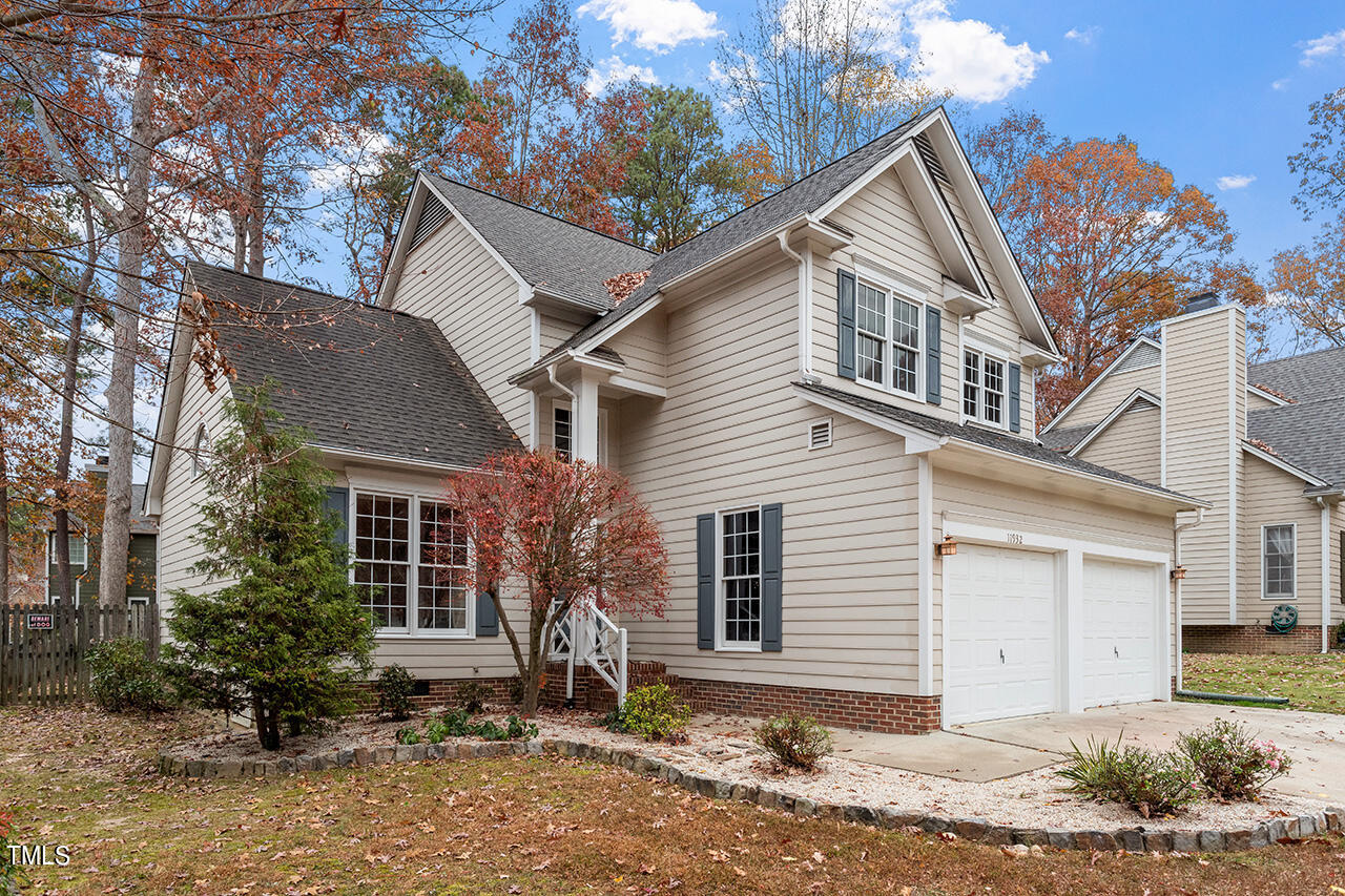 11932 North Exeter Way Raleigh, NC 27613 - Photo 1 of 35 a view of a house with a yard and large tree