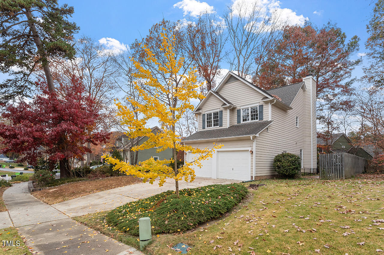 11932 North Exeter Way Raleigh, NC 27613 - Photo 2 of 35 a front view of a house with garden