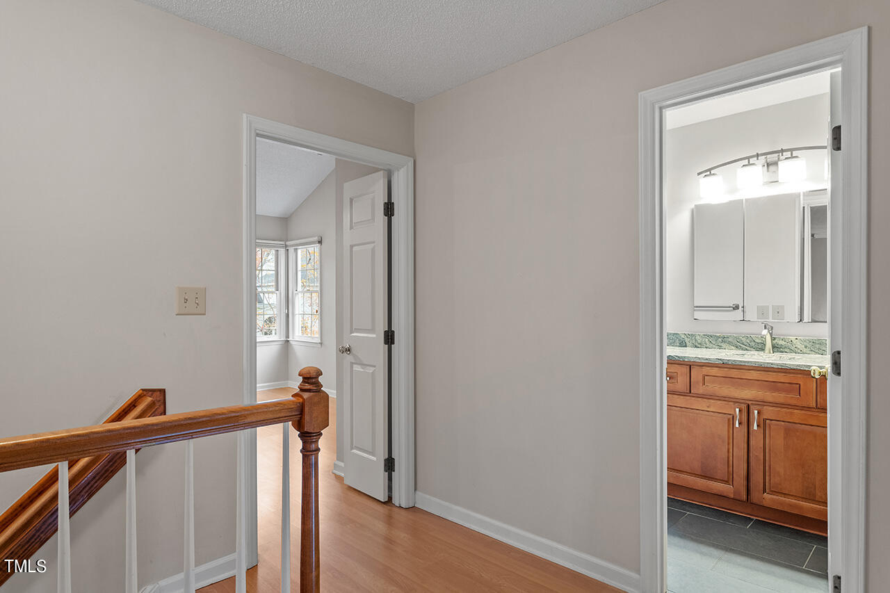 11932 North Exeter Way Raleigh, NC 27613 - Photo 28 of 35 a view of a bathroom from the hallway