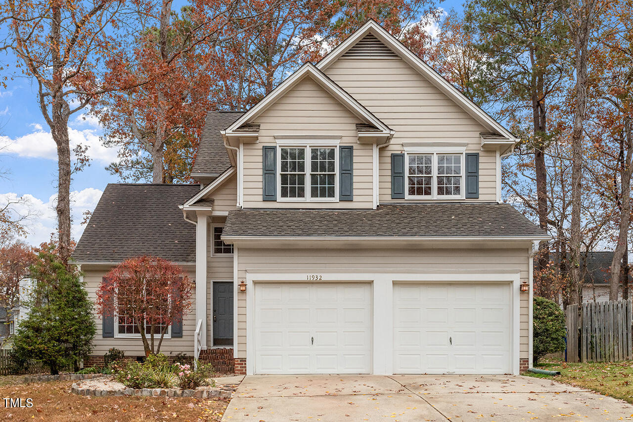 11932 North Exeter Way Raleigh, NC 27613 - Photo 3 of 35 a front view of a house with garden