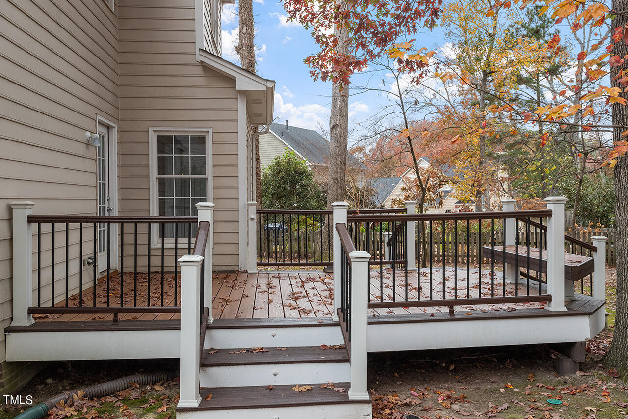 11932 North Exeter Way Raleigh, NC 27613 - Photo 7 of 35 a view of a porch with a bench