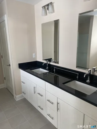 a close view of a sink and a mirror