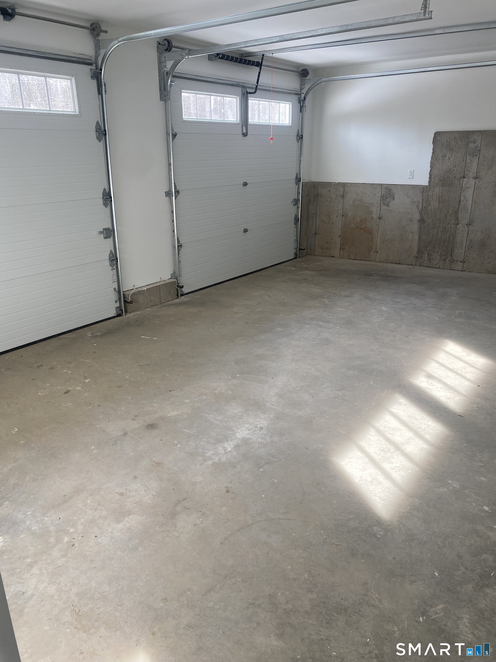 919 Strongtown Road Southbury, CT 06488 - Photo 38 of 40 Front of garage with automatic door openers. Looking from basement entrance.