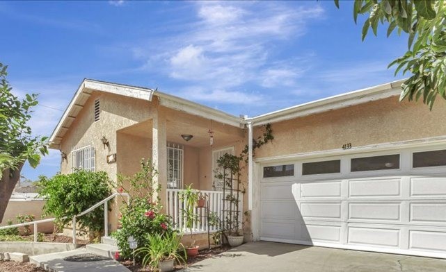 4133 North Mission Road Los Angeles, CA 90032 - Photo 1 of 40 a front view of a house with a garden