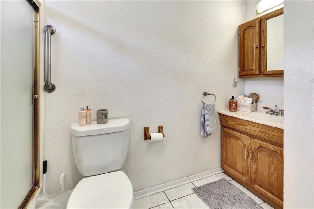 4133 North Mission Road Los Angeles, CA 90032 - Photo 19 of 40 a white toilet sitting next to a bathroom sink