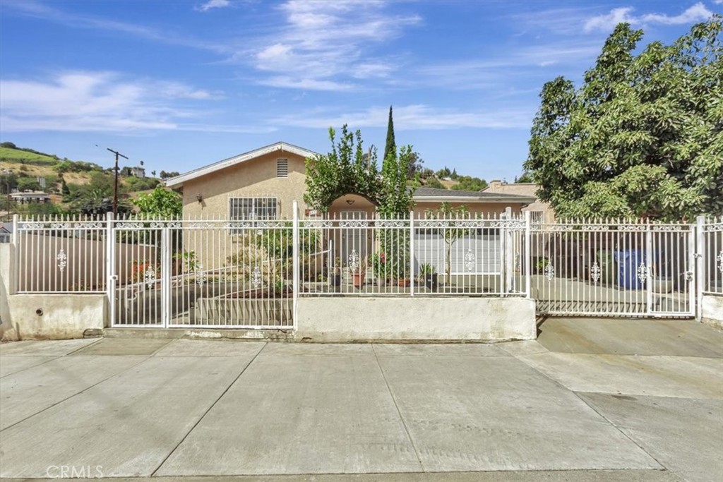 4133 North Mission Road Los Angeles, CA 90032 - Photo 4 of 40 a view of a house with wooden floor and a iron fence