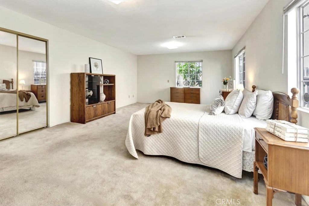 4133 North Mission Road Los Angeles, CA 90032 - Photo 10 of 40 a spacious bedroom with a bed and cabinet