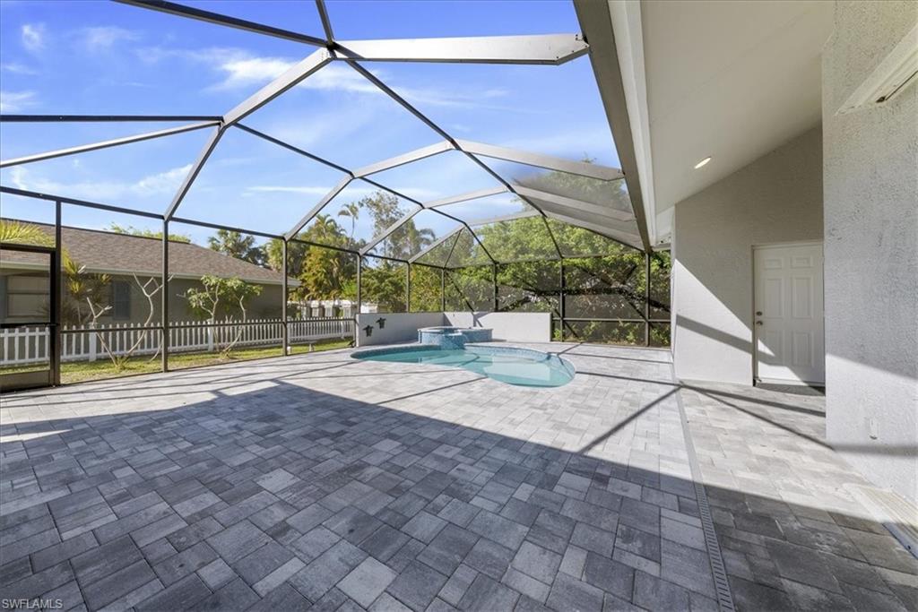 297 Sawgrass Court Naples, FL 34110 - Photo 29 of 31 a view of outdoor space with swimming pool