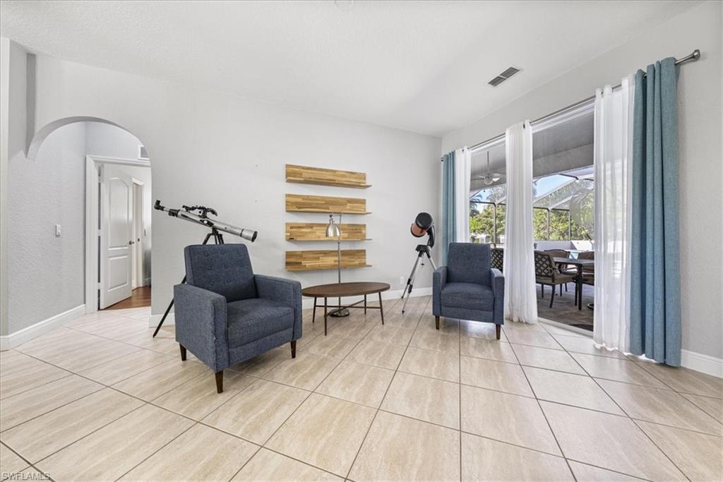297 Sawgrass Court Naples, FL 34110 - Photo 4 of 31 a living room with furniture
