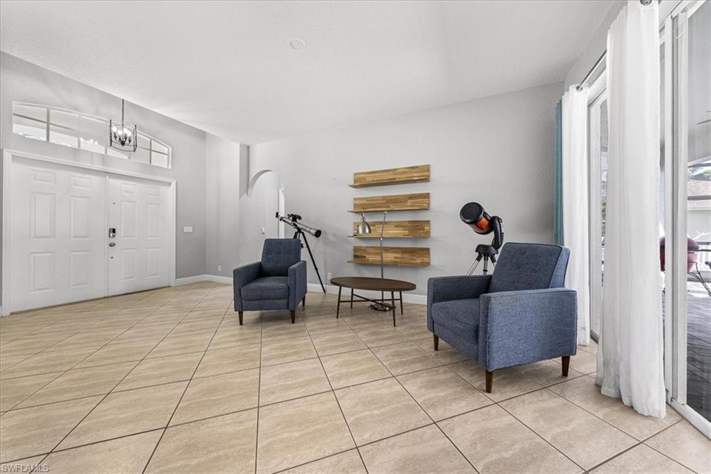 297 Sawgrass Court Naples, FL 34110 - Photo 5 of 31 a living room with furniture and a window