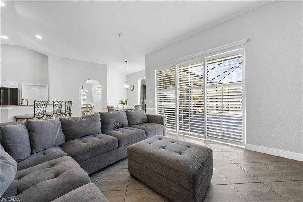 297 Sawgrass Court Naples, FL 34110 - Photo 9 of 31 a living room with furniture and a window