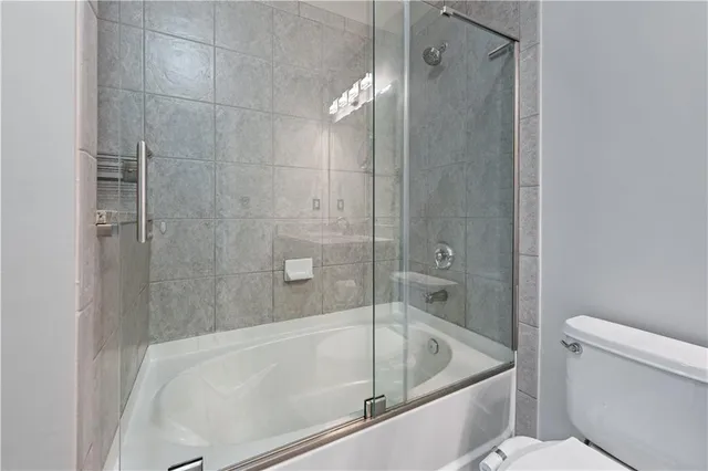 a bathroom with a tub and a shower