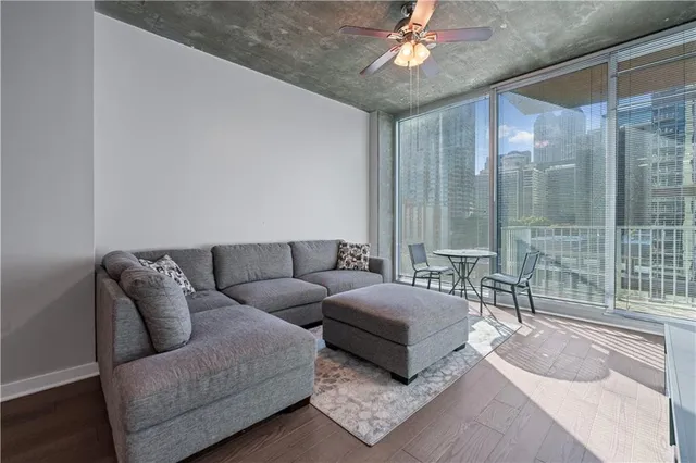 a living room with furniture and a large window