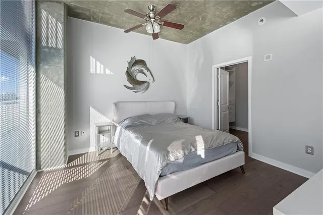 a bed sitting in a bedroom next to a bathroom