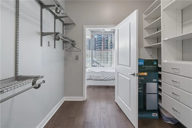 a kitchen with cabinets and wooden floor
