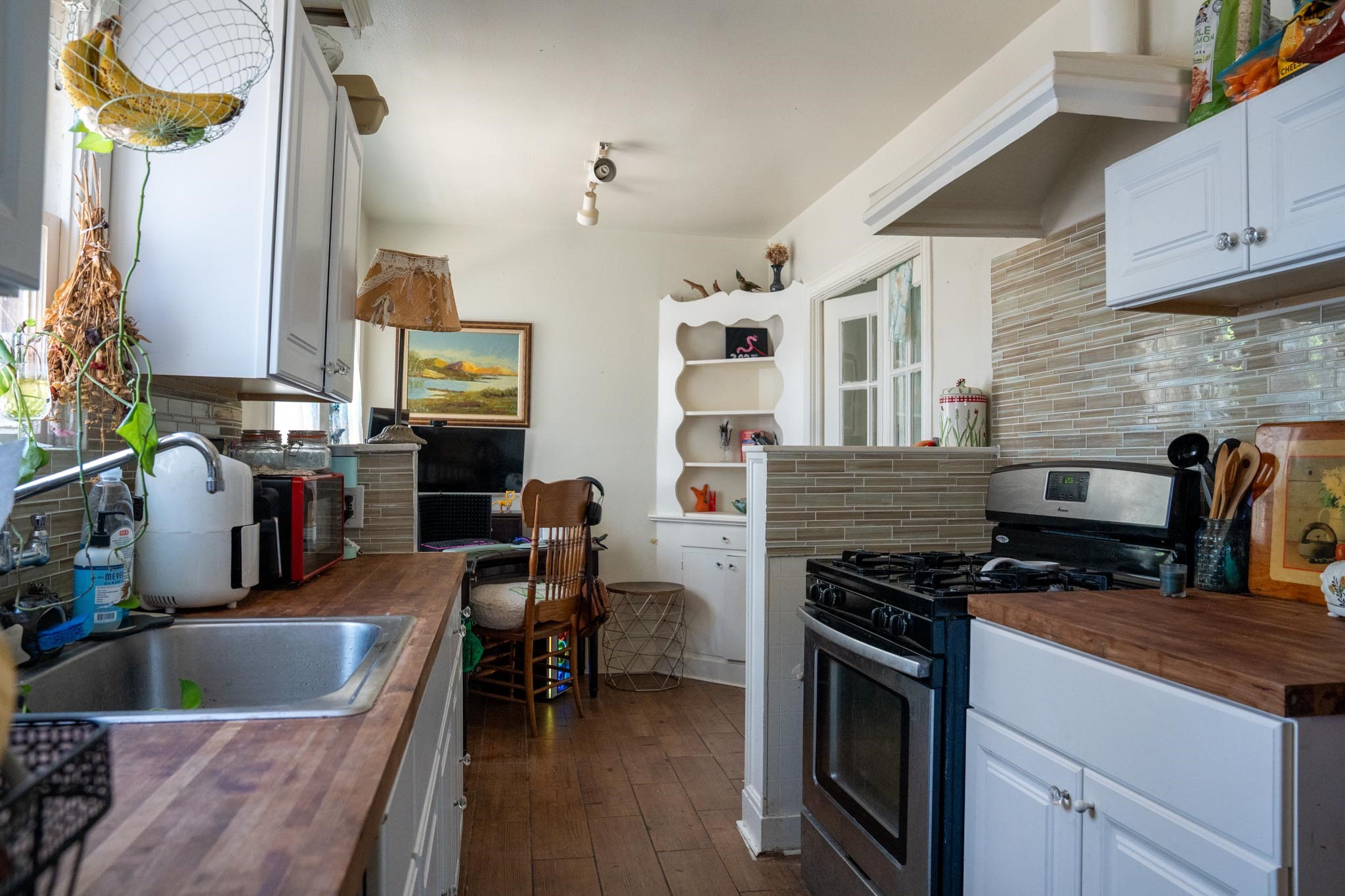 1909 Colquitt Street, Unit 7 Houston, TX 77098 - Photo 16 of 17 a kitchen with stainless steel appliances granite countertop a stove and a sink