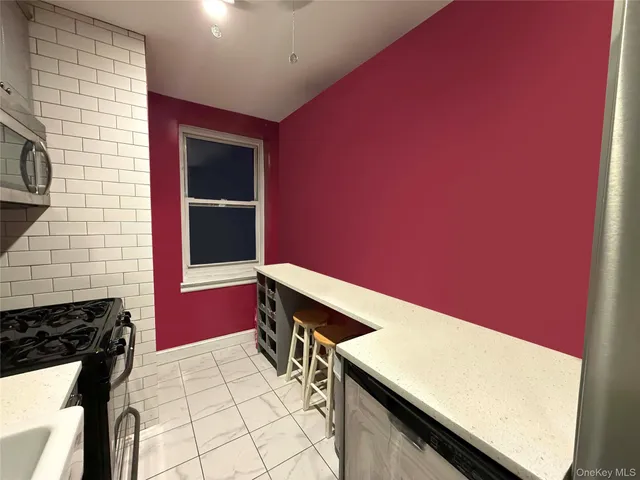 a bathroom with a sink a vanity and a window