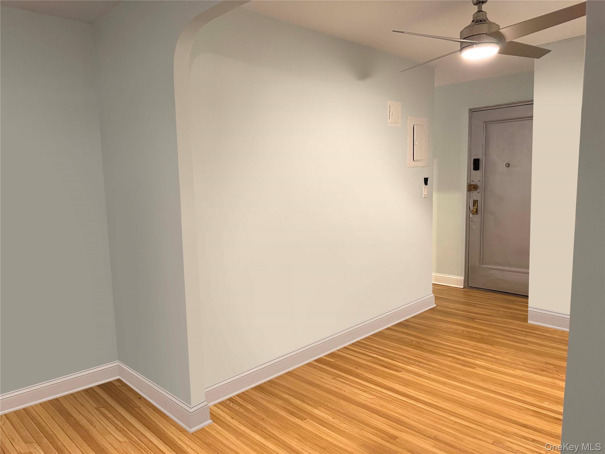 76-10 34th Avenue, Unit 3T Queens, NY 11372 - Photo 8 of 16 a view of empty room with wooden floor