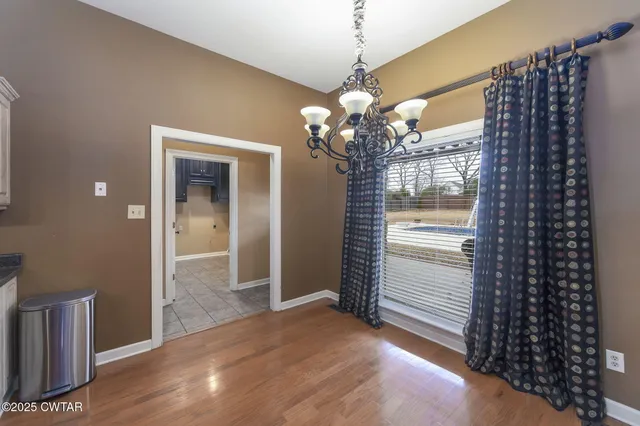 a view of a chandelier in a room with a chandelier