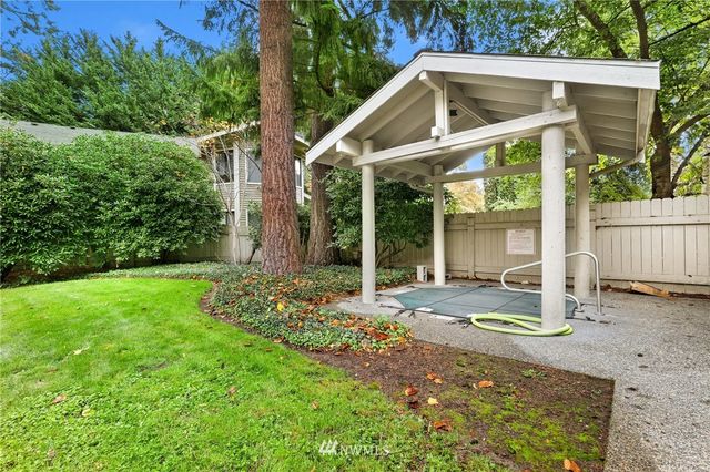 a picture of a bench in front of a wall