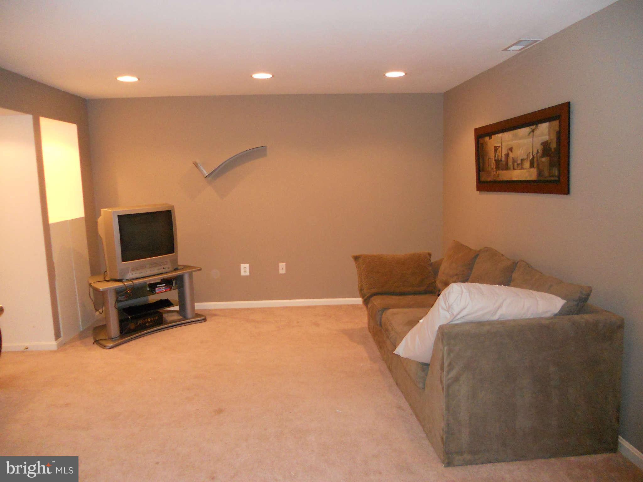 8229 Rippling Branch Road Laurel, MD 20723 - Photo 23 of 30 Lower Level recreation Room
