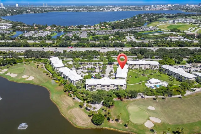 a view of a city with lots of residential buildings ocean and mountain view
