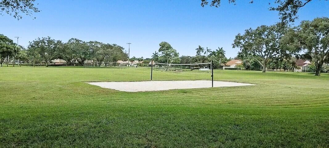 2791 Village Boulevard, Unit 105 West Palm Beach, FL 33409 - Photo 14 of 16 a view of a golf course with a lake
